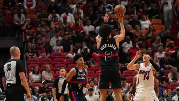 Oct 25, 2023; Miami, Florida, USA; Detroit Pistons guard Cade Cunningham (2) puts up a shot over Miami Heat guard Tyler Herro (14) during the first second half at Kaseya Center. Mandatory Credit: Jasen Vinlove-USA TODAY Sports
